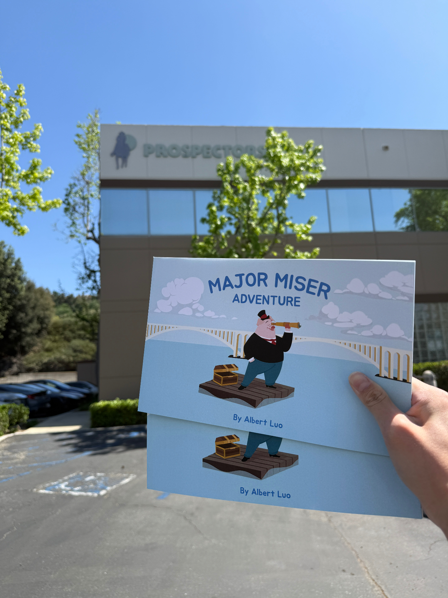 Major Miser Adventure book held outside Prospectors Credit Union